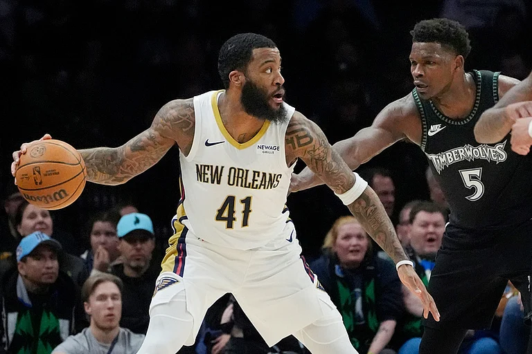 New Orleans Pelicans forward Saddiq Bey (41) works around Minnesota Timberwolves guard Anthony Edwards (5) in the first quarter of an NBA basketball game in Minneapolis. - | Photo: AP/Bruce Kluckhohn