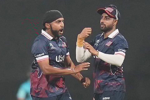 United States' Harmeet Singh, left, celebrates with teammate the wicket of India's Hardik Pandya during the T20 World Cup cricket match between India and the United States in Mumbai.
