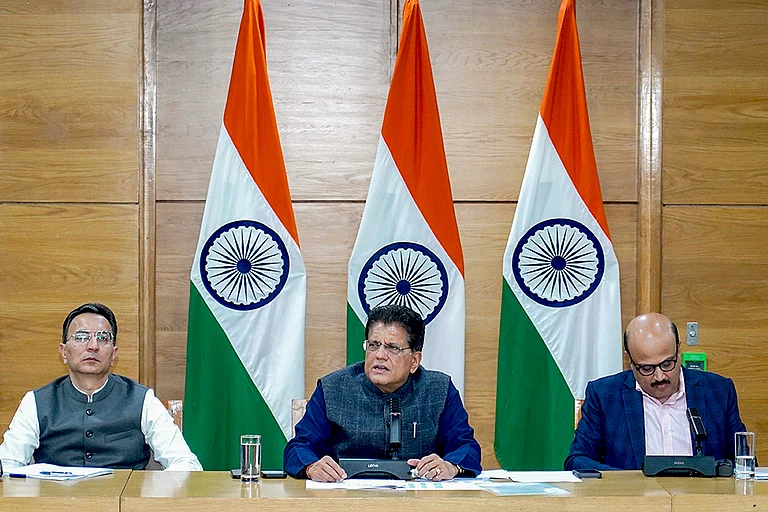 Union Minister for Commerce and Industry Piyush Goyal, centre, addresses a press conference on the India–US Trade Deal. - | Photo: PIB via PTI