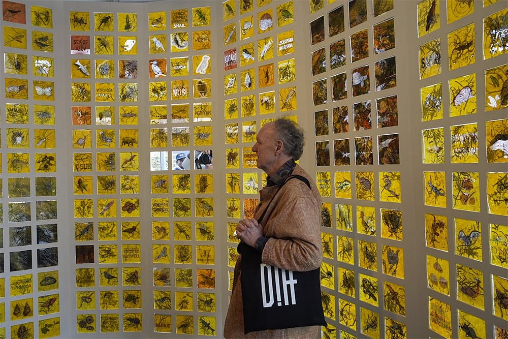 Art enthusiast watch the work of Kulpreet Singh titled Extinction Archive on the agricultural and farming practices in the aftermath of the green revolution  - | Photo: Vikram Sharma/Outlook