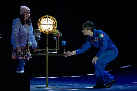 Astronaut Samantha Cristoforetti, right, perform during the Olympic opening ceremony at the 2026 Winter Olympics, in Milan, Italy.