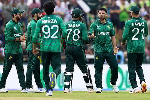 Pakistan's Abrar Ahmed, second right, celebrates with teammates the wicket of Netherlands' Colin Ackermann during the T20 World Cup cricket match between Netherlands and Pakistan in Colombo, Sri Lanka.