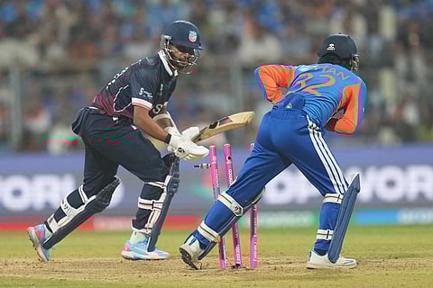 India's wicket keeper Ishan Kishan, right, stump out United States' Milind Kumar during the T20 World Cup cricket match between India and the United States in Mumbai.