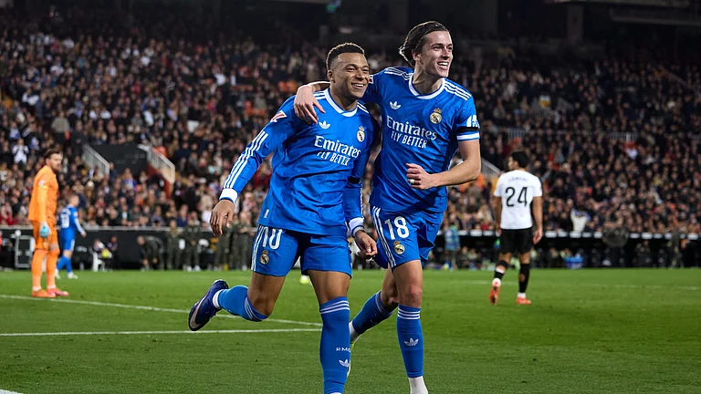 Kylian Mbappe and Alvaro Carreras celebrate. - null