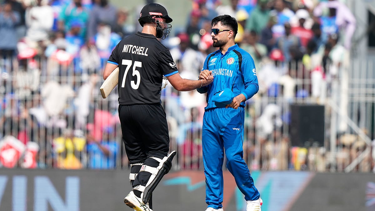 (AP Photo/Mahesh Kumar A.) : New Zealand's Daryl Mitchell, left, shakes hands with Afghanistan's captain Rashid Khan after New Zealand won their T20 World Cup cricket match against Afghanistan in Chennai, India, Sunday, Feb. 8, 2026