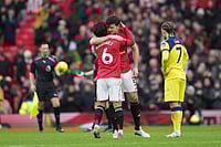 Manchester United 2-0 Tottenham, Premier League: Red Devils Make It Four In A Row Under Carrick | Photo: AP/Jon Super : Manchester United's Lisandro Martinez and Harry Maguire hug after the English Premier League soccer match between Manchester United and Tottenham in Manchester, England.