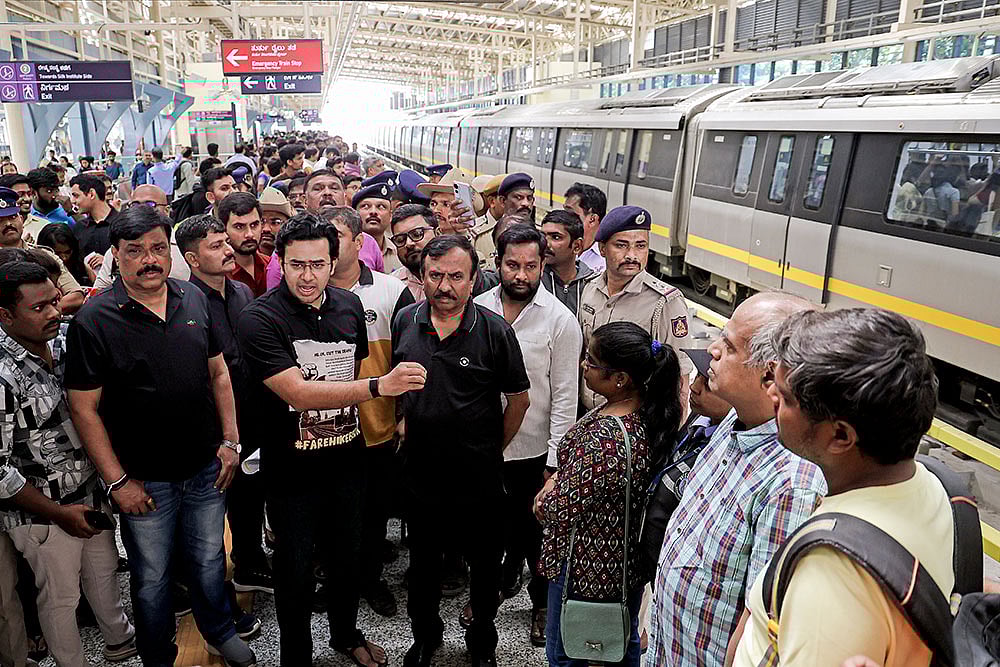 BJP MP Tejasvi Surya interacts with commuters at RV Road Metro Station over concerns regarding the proposed Bengaluru Metro fare revision, in Bengaluru, Karnataka. - Photo: PTI