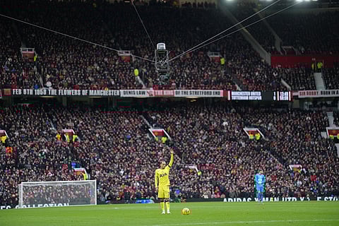 Tottenham's Xavi Simons prepares a for a free kick during the English Premier League soccer match between Manchester United and Tottenham in Manchester, England.
