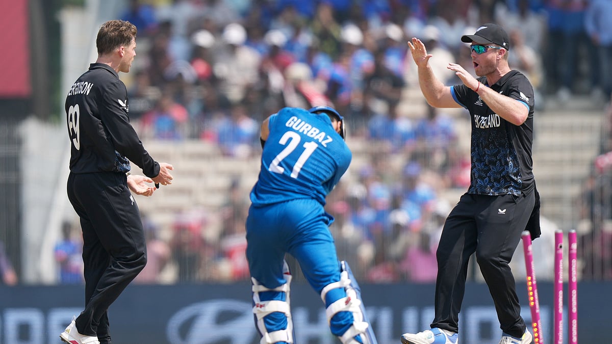 Afghanistan's Rahmanullah Gurbaz, center, is bowled out by New Zealand's Lockie Ferguson, left, during the T20 World Cup cricket match between Afghanistan and New Zealand in Chennai, India, Sunday, Feb. 8, 2026. -  (AP Photo/Mahesh Kumar A.)