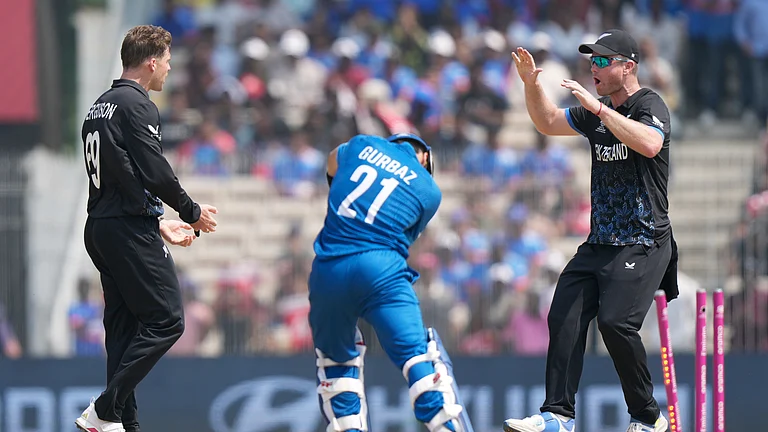 Afghanistan's Rahmanullah Gurbaz, center, is bowled out by New Zealand's Lockie Ferguson, left, during the T20 World Cup cricket match between Afghanistan and New Zealand in Chennai, India, Sunday, Feb. 8, 2026. - (AP Photo/Mahesh Kumar A.)