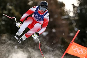| Photo: AP/Gabriele Facciotti : Switzerland's Franjo von Allmen speeds down the course during an alpine ski, men's downhill race, at the 2026 Winter Olympics, in Bormio, Italy.
