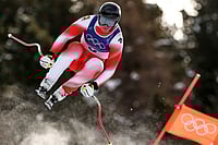 | Photo: AP/Gabriele Facciotti : Switzerland's Franjo von Allmen speeds down the course during an alpine ski, men's downhill race, at the 2026 Winter Olympics, in Bormio, Italy.