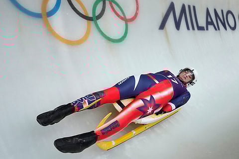 United States' Summer Britcher slides down the track during a women's single luge training session at the 2026 Winter Olympics, in Cortina d'Ampezzo, Italy.