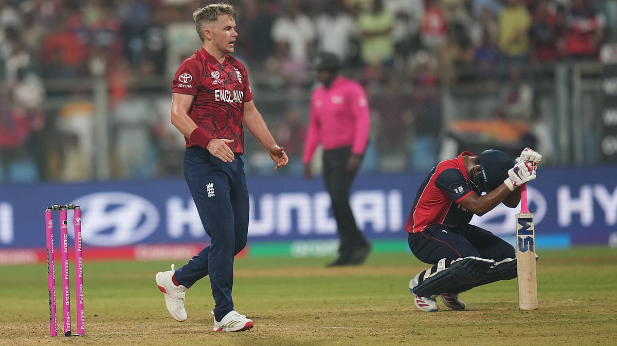 (AP Photo/Rafiq Maqbool) : England's Sam Curran celebrates after wining against Nepal during the T20 World Cup cricket match in Mumbai, India, Sunday,Feb. 8, 2026