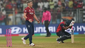 (AP Photo/Rafiq Maqbool) : England's Sam Curran celebrates after wining against Nepal during the T20 World Cup cricket match in Mumbai, India, Sunday,Feb. 8, 2026