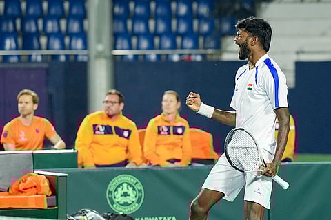 India's Dhakshineswar Suresh celebrates his victory in the second singles match of the 2026 Davis Cup Qualifiers first round tie against Netherlands' Jesper De Jong, unseen, at SM Krishna Tennis Stadium, in Bengaluru, Karnataka.