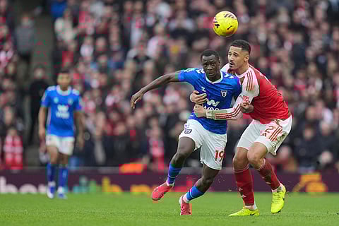 Arsenal's William Saliba holds Sunderland's Habib Diarra during the English Premier League soccer match between Arsenal and Sunderland in London, England.