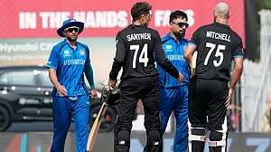 (AP Photo/Mahesh Kumar A.) : Afghanistan's captain Rashid Khan, center, greets New Zealand's Daryl Mitchell, right, and Mitchel Santner after New Zealand won their T20 World Cup cricket match against Afghanistan in Chennai, India, Sunday, Feb. 8, 2026