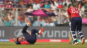 (AP Photo/Rafiq Maqbool) : Nepal's Sandeep Lamichhane fields the ball during the T20 World Cup cricket match between England and Nepal in Mumbai, India, Sunday,Feb. 8, 2026