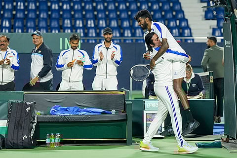 India's Dhakshineswar Suresh with captain of the Indian Davis Cup team Rohit Rajpal celebrates his victory in the second singles match of the 2026 Davis Cup Qualifiers first round tie against Netherlands' Jesper De Jong, unseen, at SM Krishna Tennis Stadium, in Bengaluru, Karnataka.