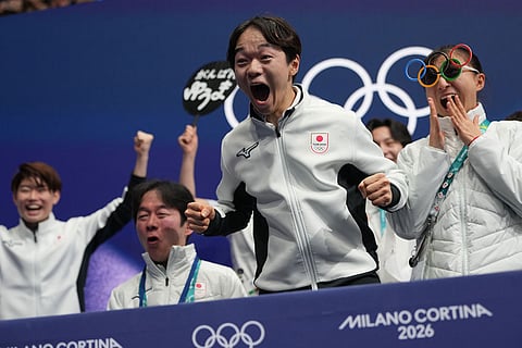 Yuma Kagiyama of Japan reacts to his scores after competing during the figure skating men's team event at the 2026 Winter Olympics, in Milan, Italy.