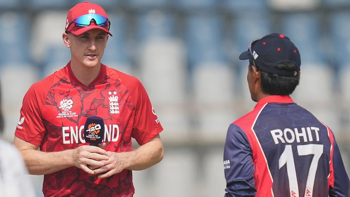 (AP Photo/Rafiq Maqbool) : England's captain Harry Brook and Nepal's captain Rohit Paudel talk during the toss at the start of the T20 World Cup cricket match between England and Nepal in Mumbai, India, Sunday, Feb. 8, 2026
