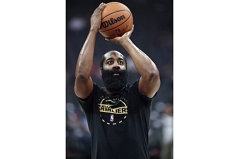 Cleveland Cavaliers guard James Harden warms up before an NBA basketball game against the Sacramento Kings in Sacramento, Calif.