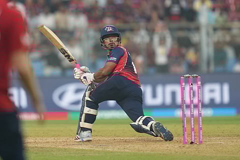 Nepal's Lokesh Bam plays a shot during the T20 World Cup cricket match between England and Nepal in Mumbai, India.
