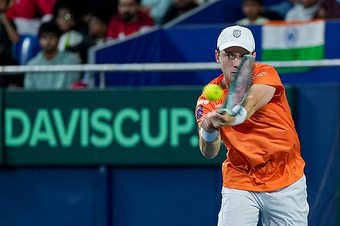 Netherlands' Guy Den Ouden competes against India's Sumit Nagal, unseen, during the first singles match of the 2026 Davis Cup Qualifiers first round tie, at SM Krishna Tennis Stadium, in Bengaluru, Karnataka.