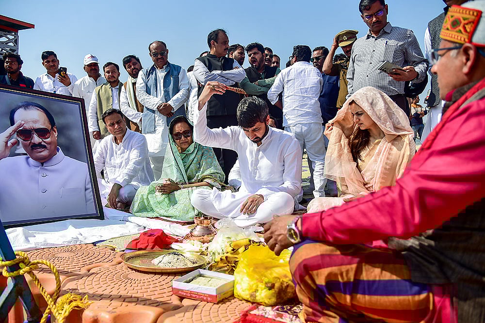 Maharashtra Deputy Chief Minister Sunetra Pawar, with Jay Pawar, son of former Maharashtra deputy chief minister Ajit Pawar, who was killed in a plane crash in Pune's Baramati, performs latters last rite rituals, in Prayagraj. - | Photo: PTI 