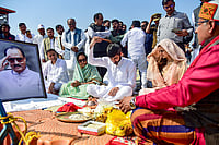 Day In Pics: February 08, 2026 | Photo: PTI : Maharashtra Deputy Chief Minister Sunetra Pawar, with Jay Pawar, son of former Maharashtra deputy chief minister Ajit Pawar, who was killed in a plane crash in Pune's Baramati, performs latters last rite rituals, in Prayagraj.
