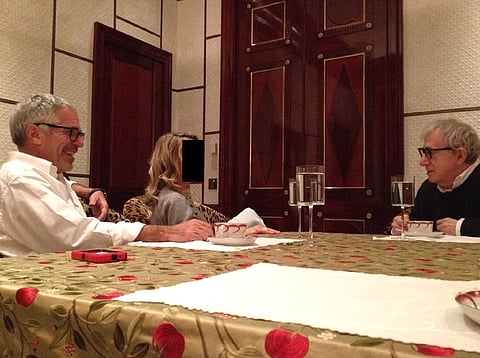 This picture shows American filmmaker WOODY ALLEN, right, chats with JEFFREY EPSTEIN, left, and an unidentified blonde woman whose face has been redacted, from the Epstein personal collection. The photos are part of a cache of 95,000 being reviewed by the committee.