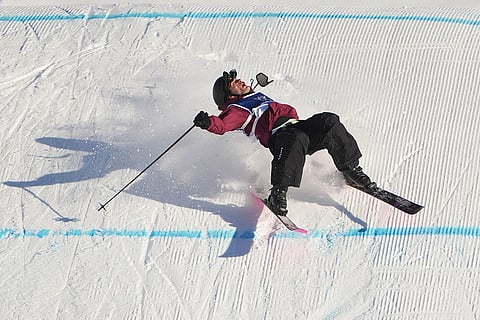 Austria's Julius Forer crashes during men's freestyle skiing slopestyle qualifications at the 2026 Winter Olympics, in Livigno, Italy.