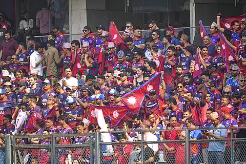Nepal cricket team supporters cheer during the T20 World Cup cricket match between England and Nepal in Mumbai, India.