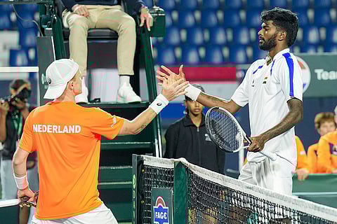 India's Dhakshineswar Suresh, right, exchanges greetings with Netherlands' Jesper De Jong after the former's victory in the second singles match of the 2026 Davis Cup Qualifiers first round tie, at SM Krishna Tennis Stadium, in Bengaluru, Karnataka.