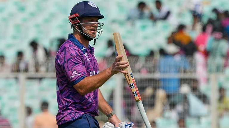 Scotland's George Munsey leaves the ground after losing his wicket during the T20 World Cup cricket match between Italy and Scotland in Kolkata, India, Monday, Feb. 9, 2026 - (AP Photo/Bikas Das)