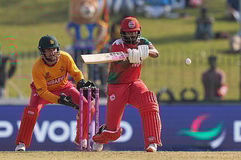 Oman's Vinayak Shukla plays a shot during the T20 World Cup cricket match between Oman and Zimbabwe in Colombo, Sri Lanka.
