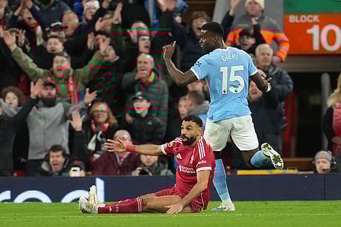 Liverpool's Mohamed Salah reacts during the English Premier League soccer match between Liverpool and Manchester City in Liverpool, England.