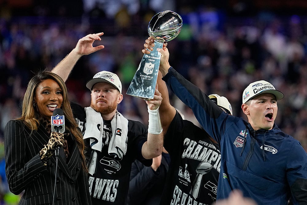 Seattle Seahawks head coach Mike MacDonald, right, and quarterback Sam Darnold lift the Lombardi Trophy after win over the New England Patriots in the NFL Super Bowl 60 football game in Santa Clara, California. - | Photo: AP/Julio Cortez