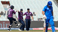 (AP Photo/Bikas Das) : Scotland's Matthew Cross, left, celebrates with teammates the wicket of Italy's Justin Mosca, right, with teammate of during the T20 World Cup cricket match between Italy and Scotland in Kolkata, India, Monday, Feb. 9, 2026
