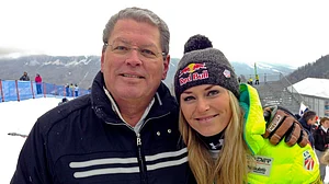 (AP Photo/Andrew Dampf, File) : United States' Lindsey Vonn, right, poses for photographs with her father Alan Kildow at the end of an alpine ski, women's World Cup downhill race, in Cortina d'Ampezzo, Italy, Friday, Jan. 16, 2015.