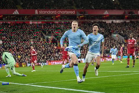 Manchester City's Erling Haaland celebrates after scoring during the English Premier League soccer match between Liverpool and Manchester City in Liverpool, England.