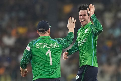 Ireland's George Dockrell, right, celebrates the wicket of Sri Lanka's Pavan Rathnayake during the T20 World Cup cricket match between Sri Lanka and Ireland in Colombo, Sri Lanka.