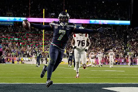 Seattle Seahawks linebacker Uchenna Nwosu (7) celebrates after scoring against the New England Patriots during the second half of the NFL Super Bowl 60 football game in Santa Clara, California.