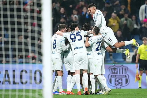 Inter Milan's Manuel Akanji celebrates after scoring their side's fourth goal of the game during the Serie A soccer match between Sassuolo and Inter in Milan, Italy.