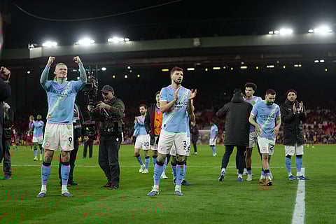 Manchester City players celebrate after the English Premier League soccer match between Liverpool and Manchester City in Liverpool, England.