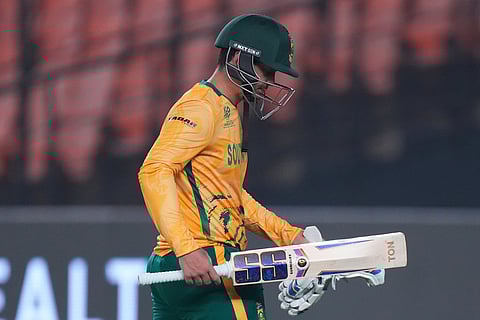 South Africa's Quinton de Kock leaves the ground after losing his wicket during the T20 World Cup cricket match between Canada and South Africa in Ahmedabad.