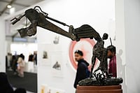 Vikram Sharma : Debanjan Roy’s sculpture at India Art Fair places a modest Gandhi under the looming arm of a bulldozer
