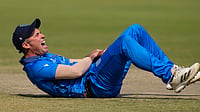 Scotland Vs Italy, T20 World Cup 2026: Azzurri Rocked As Skipper Wayne Madsen Hurts Shoulder In Opening Match – Video (AP Photo/Bikas Das) : Italy's captain Wayne Madsen reacts after a miss-fielding by him which hurt his hand during the T20 World Cup cricket match between Italy and Scotland in Kolkata, India, Monday, Feb. 9, 2026