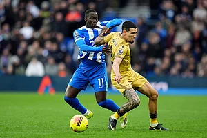 | Photo: Adam Davy/PA via AP : Brighton and Hove Albion's Yankuba Minteh, left, and Crystal Palace's Daniel Munoz in action during their English Premier League soccer match in Brighton, England.